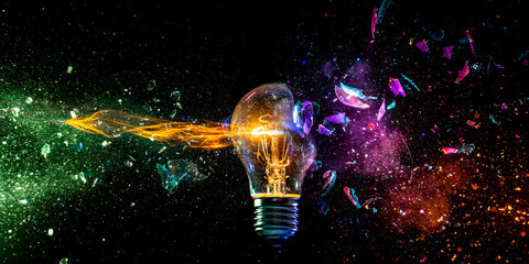 Fototapete - Exploding light bulb concept on dark background