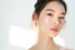 © QuietWord - close up face portrait of young pretty Asian woman with bright flawless skin, beauty cosmetic or skincare fashion portrait with copy space