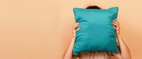 Woman Holding Teal Blue Pillow with Beige Background