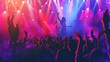 © olga_demina - Dynamic concert crowd with hands raised under vibrant stage lighting. Captures the excitement and energy of live music events and festivals.