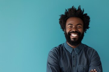Wall Mural - Black Man Blue Background. Smiling Afro-American Guy in Casual Attire on Blue Background