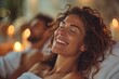 © Leo - Woman enjoying a spa treatment with soft lighting and a joyful expression, creating a relaxing and happy atmosphere