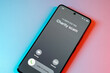 © Rokas - Charity Scam call concept on mobile phone. Person get scam call alert. Phone call from unknown number late at night. Scam, fraud or phishing with smartphone concept. Prank caller, scammer or stranger