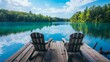 © Nijat - Two Adirondack chairs are positioned on a wooden dock, facing a serene, blue lake
