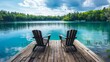 © Nijat - Two Adirondack chairs are positioned on a wooden dock, facing a serene, blue lake
