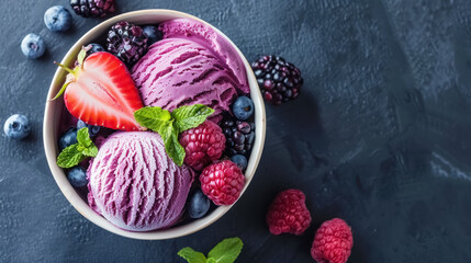 delicious acai bowl with purple ice cream, fresh berries, and mint on dark background