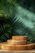 © Iuliia - A wooden podium with green background , adorned by palm leaves. The podium  for product display