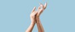 © Pixel-Shot - Hands in soap foam on light blue background