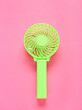 © Pixel-Shot - Modern manual fan on pink background