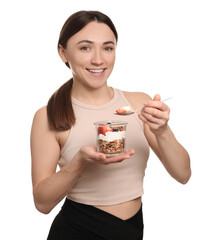 Wall Mural - Happy woman eating tasty granola with fresh berries and yogurt on white background