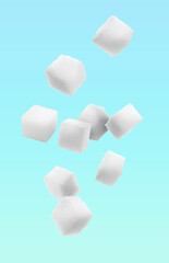 Poster - Refined sugar cubes in air on light blue background