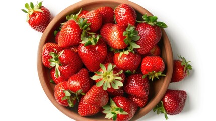 Wall Mural - Juicy ripe strawberries in a bowl set against a white backdrop photographed from above