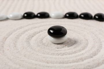 Wall Mural - Stones on sand with lines in Japanese rock garden. Zen concept