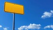 © admin_design - Blank yellow road sign against a bright blue sky with scattered white clouds, perfect for various conceptual uses and copy space.