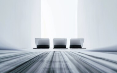 Aufkleber - Abstract Entrepreneurship Concept with Three Laptops and Blurred Financial Documents in a Symmetrical Composition, Captured Using Long Exposure