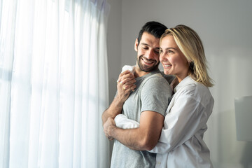 Wall Mural - Caucasian young couple spend free leisure time together in living room.