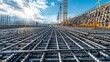 © Дмитрий Симаков - A construction site with a large crane and a lot of metal bars. The bars are in a grid pattern and are being used to support the construction