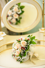 Wedding bouquet of roses for a wedding. Wedding accessories made from fresh flowers. Wedding day. Vertical image.