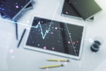 Poster - Creative abstract heart pulse hologram and modern digital tablet on desktop on background, top view, online medical consulting concept. Multiexposure