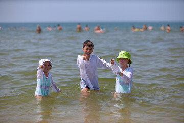 Group of Children Standing in the Ocean