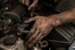 © Юлия Черкасова - Dirty male hands close-up. An auto mechanic repairs and diagnoses cars, close-up.