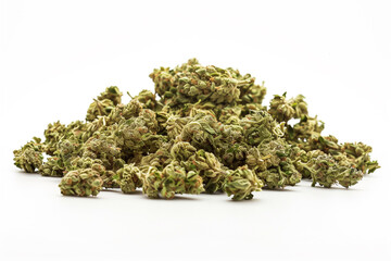 A pile of marijuana buds on a white background. The buds are small and green, and they are scattered all over the surface. Concept of abundance and variety