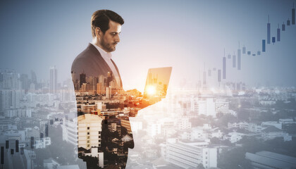 Canvas Print - Attractive young european businessman with laptop standing on blurry airy city background with mock up place and candlestick forex chart. Future, communication, tomorrow concept. Double exposure.