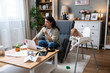 © Srdjan - Young single divorced mother with baby using laptop computer for video call with her lawyer, talking about ex husband who not paying alimony and expenses and cost of living with small child.