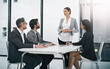 © peopleimages.com - Business, woman and boardroom with feedback for teamwork, collaboration and people on company growth. Employee, accountant and office with strategy, report and meeting with clients for project