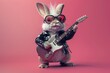 © Phuriphat - A rabbit is holding a guitar and wearing sunglasses