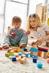 Wall Mural - A curly mother and her toddler daughter bonding and learning through play with blocks on the floor at home.