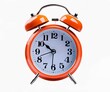 © Robert Kiyosaki - Title: Vibrant red alarm clock against on white background