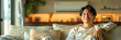© Jirawatfoto - Happy asian man relaxing on sofa under air conditioner with air flow in living room. Green clean air living room concept.