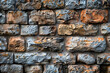 © Daniel - Ancient stone wall of an 18th century castle or fortress with weathered and cracked bricks in close up view