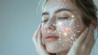 © Sippung - Woman with glowing white lines connecting dots on face showcasing skincare technology