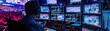 © ParinApril - A professional broadcast setup at a nighttime sports event, with a technician monitoring multiple screens, ensuring seamless coverage