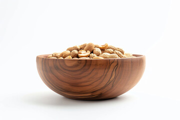 Wall Mural - a wooden bowl filled with peanuts on a white surface