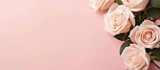 Poster - Blank white paper bouquet of light beautiful cream roses on pastel pink background Festive flower composition Top view flat lay. Creative banner. Copyspace image