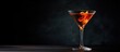 © HN Works - A vertical shot of a classic cocktail on dark background. Creative banner. Copyspace image