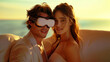 © bluecreamy - young beautiful couple with a VR headset, sitting close to each other, on a white couch, the woman looking at the camera with a smile. at sunset, with warm light creating a soft and intimate ambiance