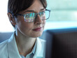 © Connect Images - Genomics, Scientist viewing human DNA profiles on screen during testing in the lab