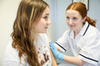© Connect Images - Nurse treating young girl's arm