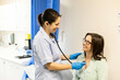 © Connect Images - Nurse checking patient with stethoscope