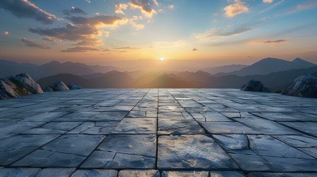 Empty square floor with a mountain landscape background at a sunset sky. Empty concrete tile platform for product display, an outdoor nature scene. A panoramic view of green hills and clouds in summer
