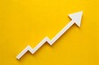 © Nida - Graphical representation of growth with upward arrow on bright yellow background, indicating rising trend
