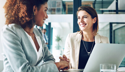 Canvas Print - Business people, meeting and handshake by women in office with laptop for startup, profit or loan success. Partnership, congratulations and mentor shaking hands with intern for training milestone