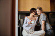 © Bliss - Two young lesbian lovers enjoy morning coffee in a cozy hotel kitchen