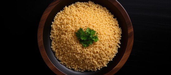 Aufkleber - Bulgur wheat in a black plate on black background Top view copy space Flat lay