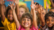 © nopommajun - Young, enthusiastic schoolchildren raising their hands in an engaging classroom environment