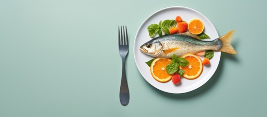 Poster - Leafy salad with red fried fish and orange on a white plate with a fork on a grey background Background image copy space